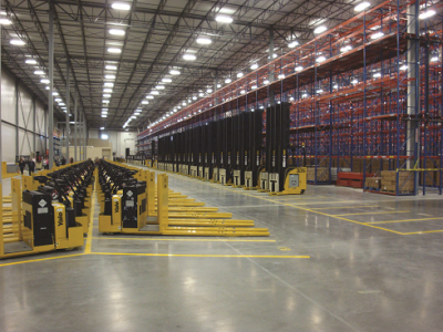  A feleet of Yale end rider forklifts and narrow aisle forklifts in a warehouse using carton flow racking.A feleet of Yale end rider forklifts and narrow aisle forklifts in a warehouse using carton flow racking.