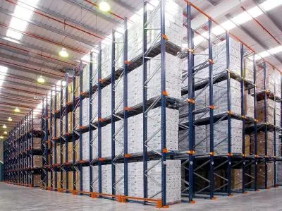  Aisle of pallet racking with goods stored in a warehouse.Aisle of pallet racking with goods stored in a warehouse.